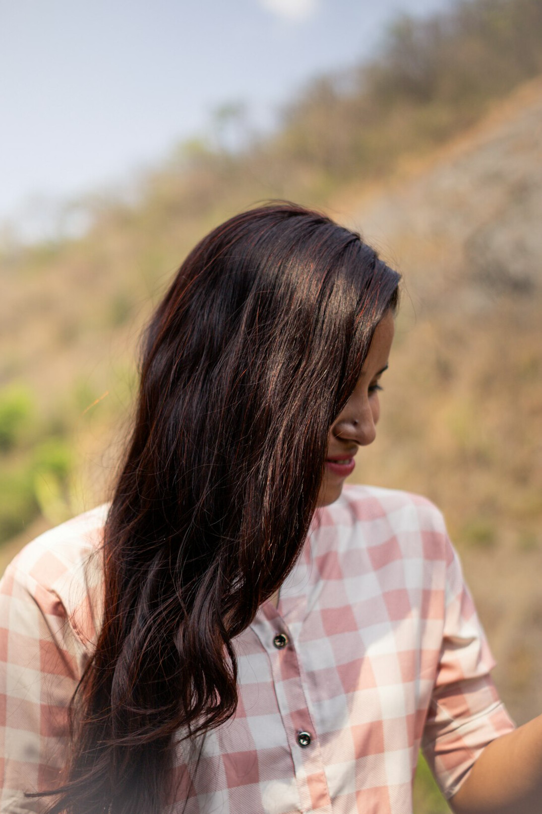 Portrait of a woman with long hair smiling
