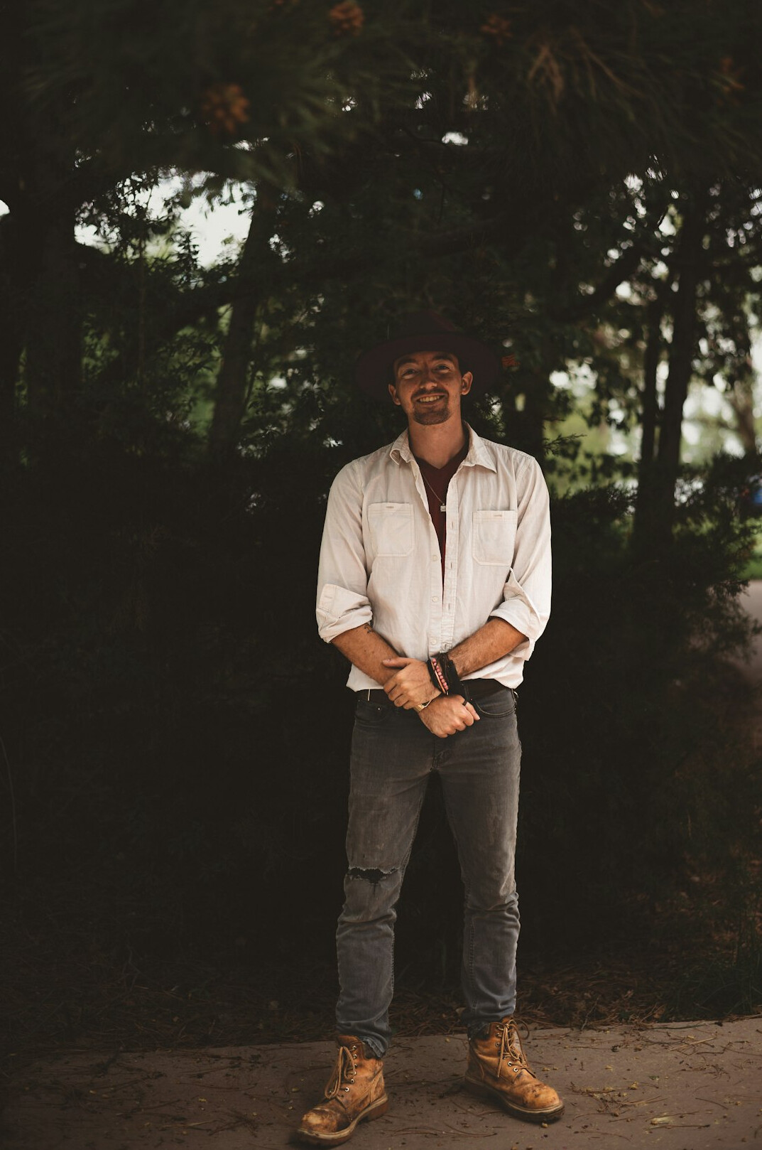 Portrait of a man in a light shirt smiling