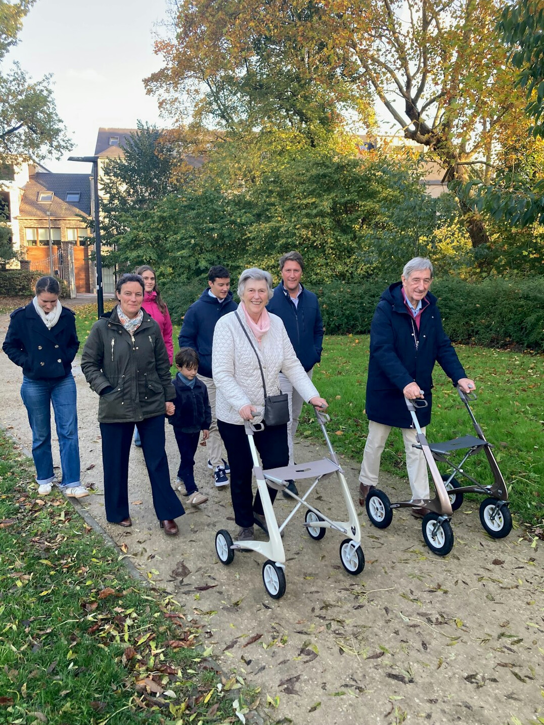 elderly couple walking in park