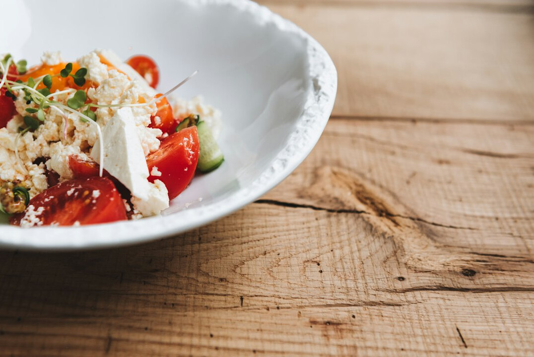 Healthy meal with vegetables and grains on a wooden table
